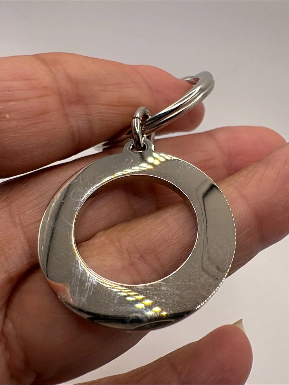 Coach Silver-Tone Round Logo Keyring with Black Accent